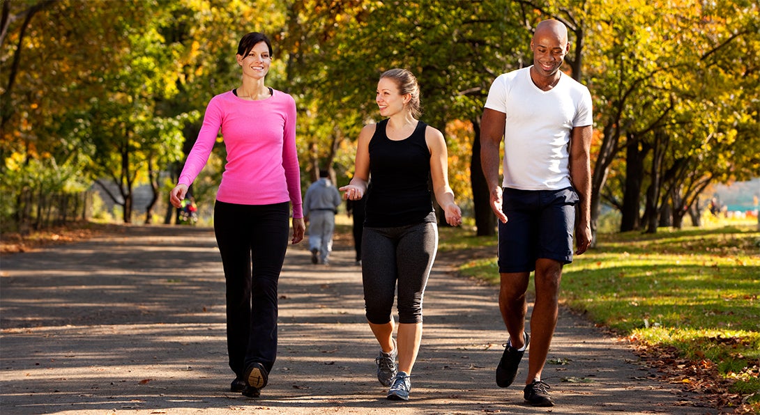 a group of people walking outside